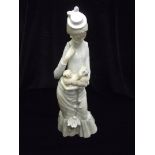 Lladro figure of a lady holding a dog 38cm with original box