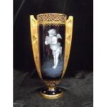 Late 19th century Coalport pate-sur-pate vase depicting a cherub playing panpipes, numbered A9205,
