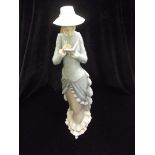 Lladro figure of an elegant lady holding a book 37cm