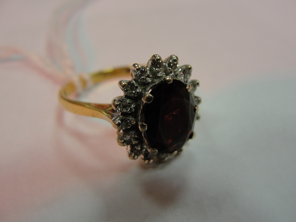 An 18ct diamond and brownstone ring