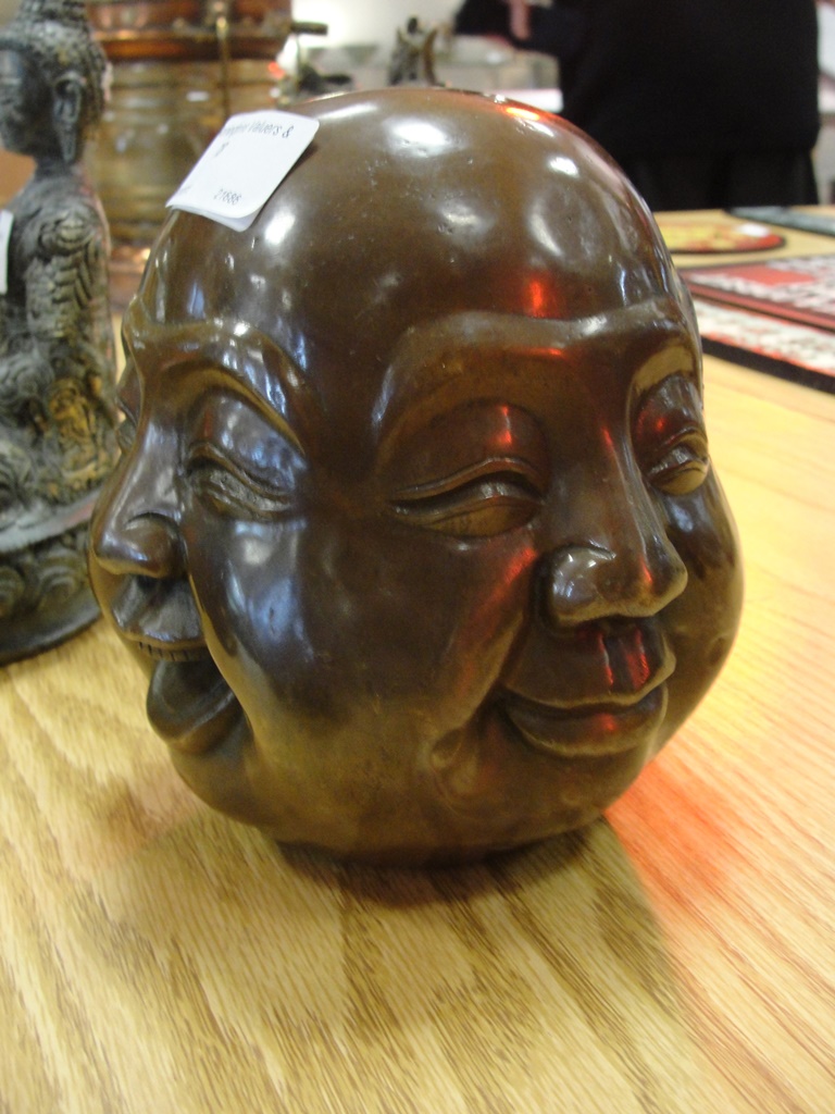 A four-face bronze buddah