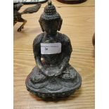 A bronze figure of a buddah