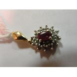 A 9ct ruby and diamond pendant