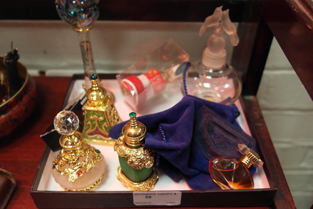 A quantity of perfume bottles to inc a V