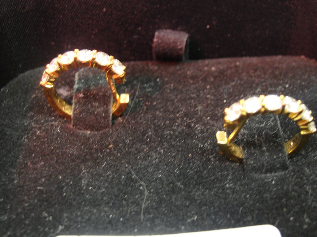 A pair of 18ct diamond set hoop earrings
