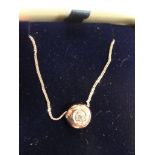 A 9ct chain and diamond pendant