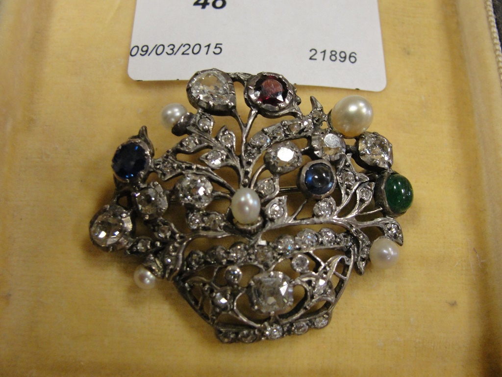 A Victorian brooch in the form of a bask