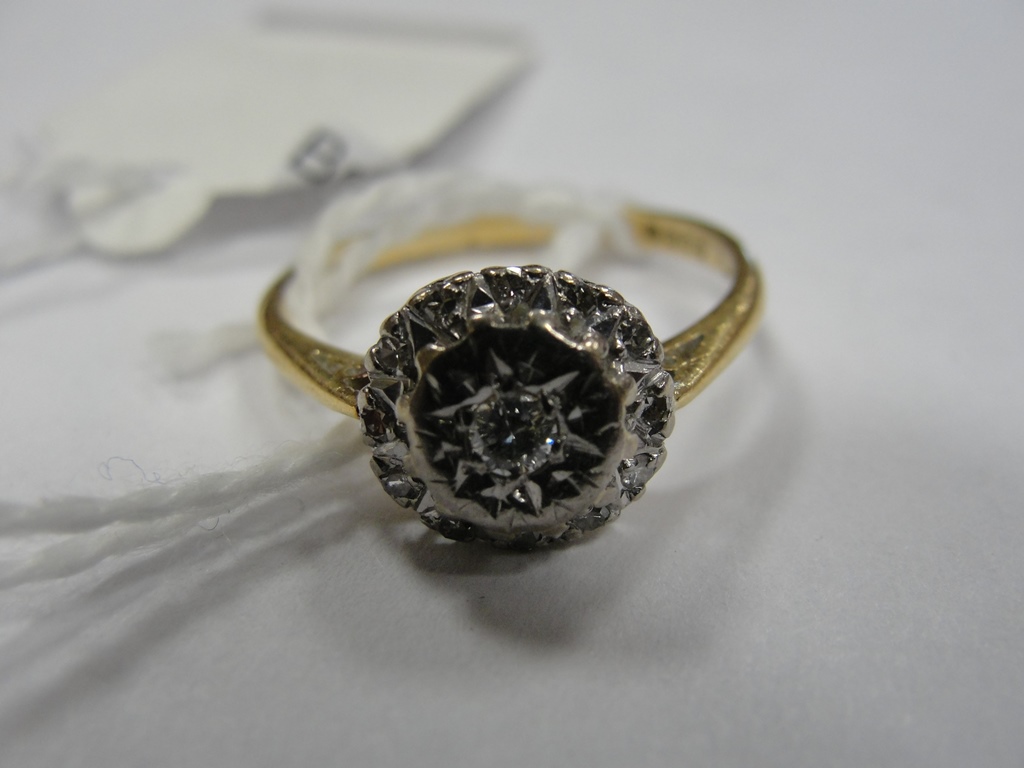 An 18ct diamond cluster ring