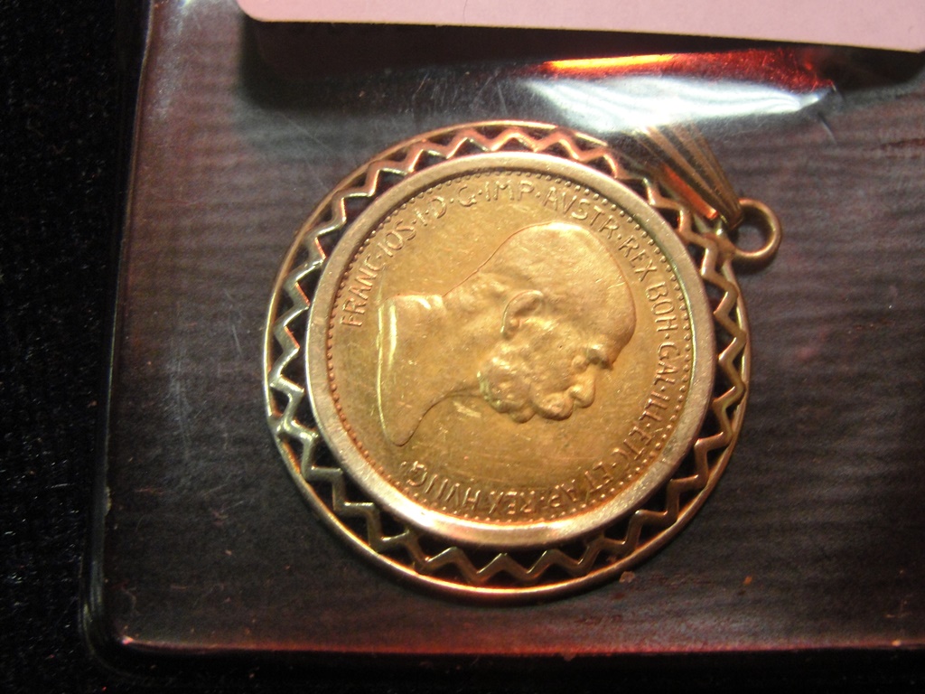 A 1909 10 corona coin in 9ct mount