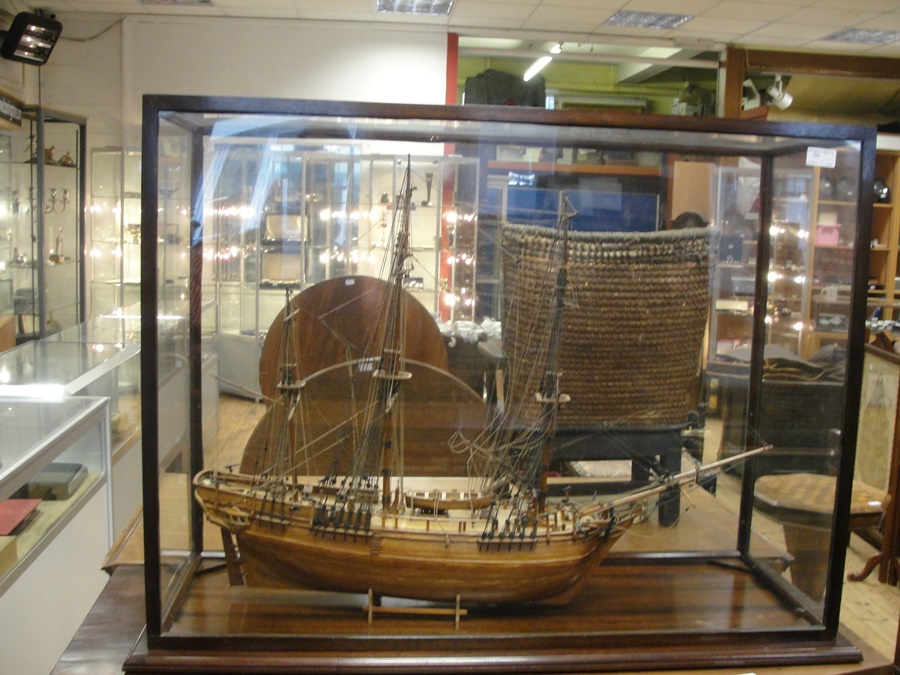 A boat within a glass case
