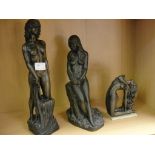 Three bronzed figures: standing ladies