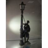 A boxed Lladro figure: 'Lamplighter'