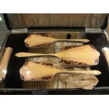 A cased Art Deco brush set