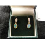 A pair of 18ct Australian black opal and