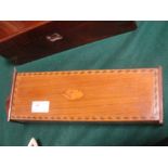 An Edwardian mahogany inlaid candle box