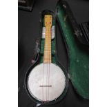 A cased vintage ukelele/banjo