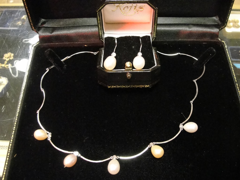 An 18ct white gold, pearl and diamond ne