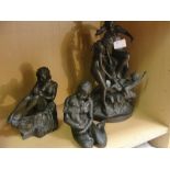 Three bronzed figures of women and babie