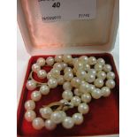 A 9ct clasp string of pearls; together w