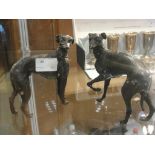 A pair of bronze figures of greyhounds