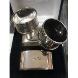 Two cased silver napkin rings; together with two other silver napkin rings