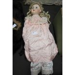 A 19th century J Steiner A.18 doll with lace and silk clothing