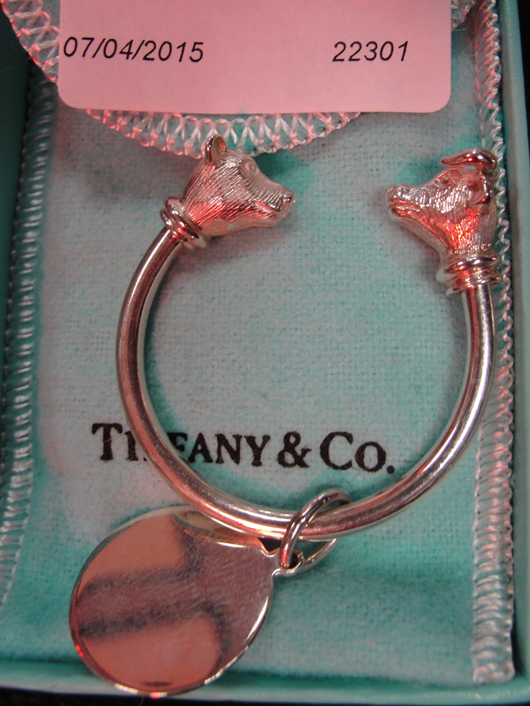 A sterling silver keyring with bear and bull head terminals by Tiffany & Co