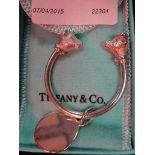 A sterling silver keyring with bear and bull head terminals by Tiffany & Co