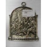 A 19th century French white metal arched plaque depicting The Birth of Christ, signed lower right