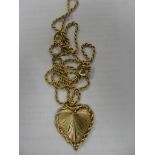 A 14k gold heart pendant on 18ct rope chain