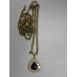 A diamond and sapphire pendant necklace
