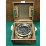 A ship's compass having brass surround, the side bearing a brass plaque and below a crown, Ref