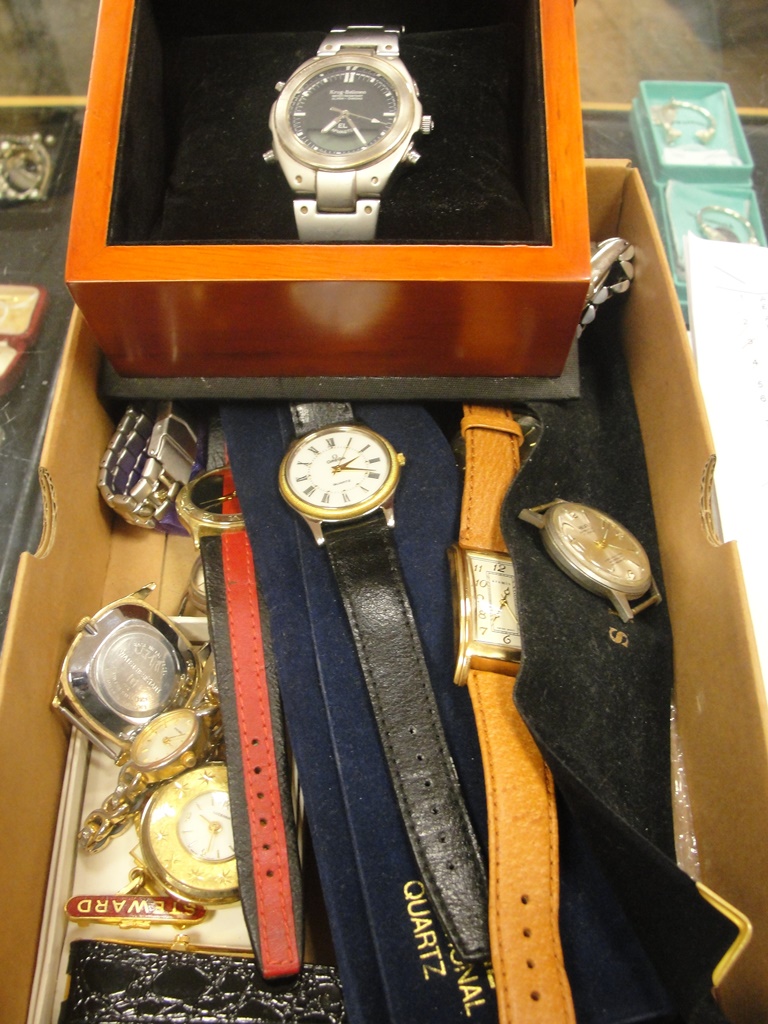 A box of vintage gentlemens and ladies wristwatches