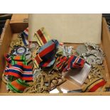 A box of WWI & WWII medals; together with cap badges