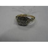 An 18ct and platinum nine-stone diamond dress ring,