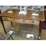 A mahogany leather top Sheraton revival style desk