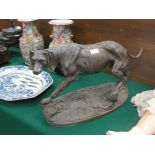 A large bronze figure of a hound on base