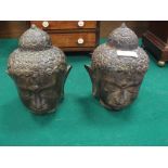 A pair of bronze Buddah heads