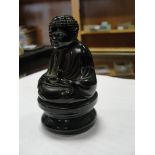 A red amber style buddha