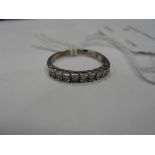 A 9ct diamond half eternity ring