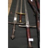 Three re-enactors medieval swords
