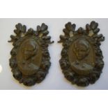 A pair of bronze portrait plaques