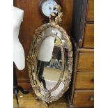 A large Rococo-style gilt mirror