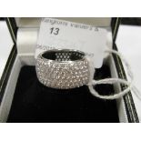 An 18ct multi-diamond stone set wide full eternity ring,