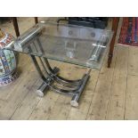 A modernist  glass topped chrome table