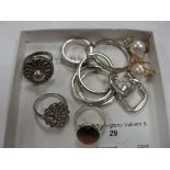 A quantity of silver rings and earrings