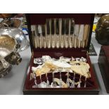 A mahogany cased canteen of cutlery