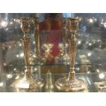 A pair of HM silver candlesticks