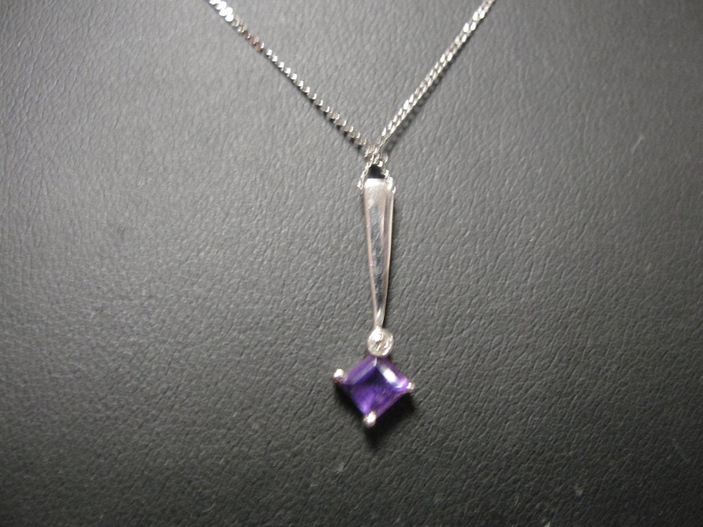A 9ct chain with Deco-style diamond and amethyst pendant