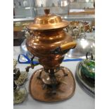 A 19th century copper samovar with copper tray